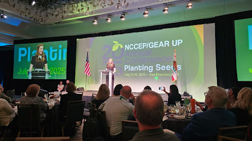 Corinne Smith delivers remarks while accepting the GEAR UP Professional of the Year award in 2025