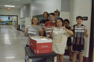 Heritage Middle School students pose for a photo with some of the bags collected. Chrissy Murphy, Morganton News Herald
