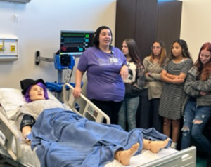 GEAR UP students learn about the patient care simulators at TCCC. 